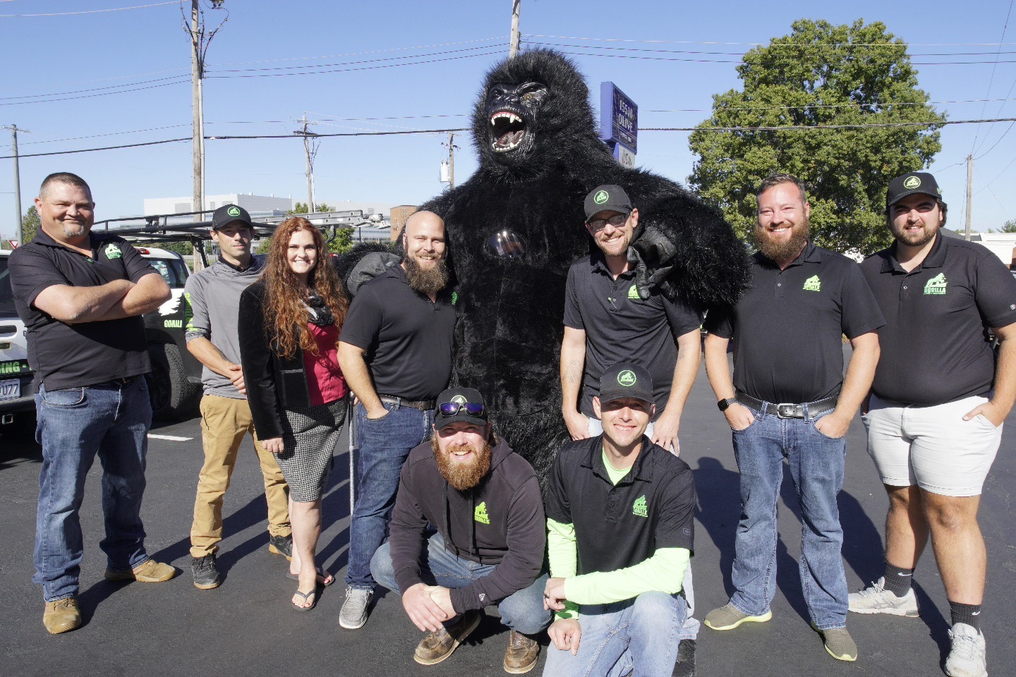 Gorilla Roofing pictures outside on sunny day.