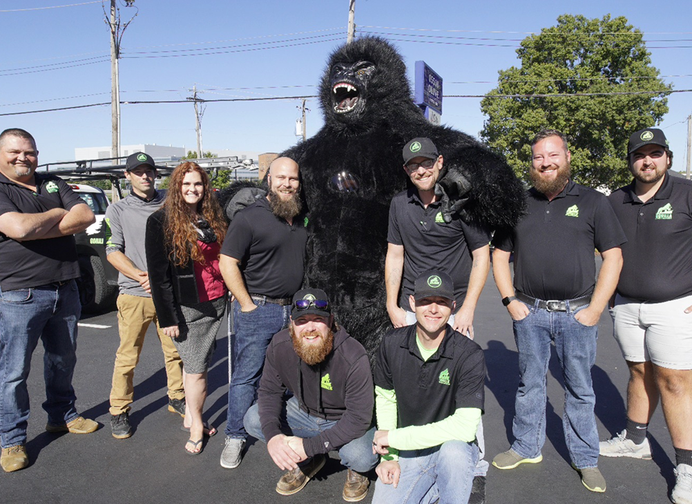 A split image showing a roof renovation process. On the left, a wooden frame with plywood sheets laid out, indicating the 'Before' stage. On the right, a finished roof covered with gray shingles, labeled 'After'.